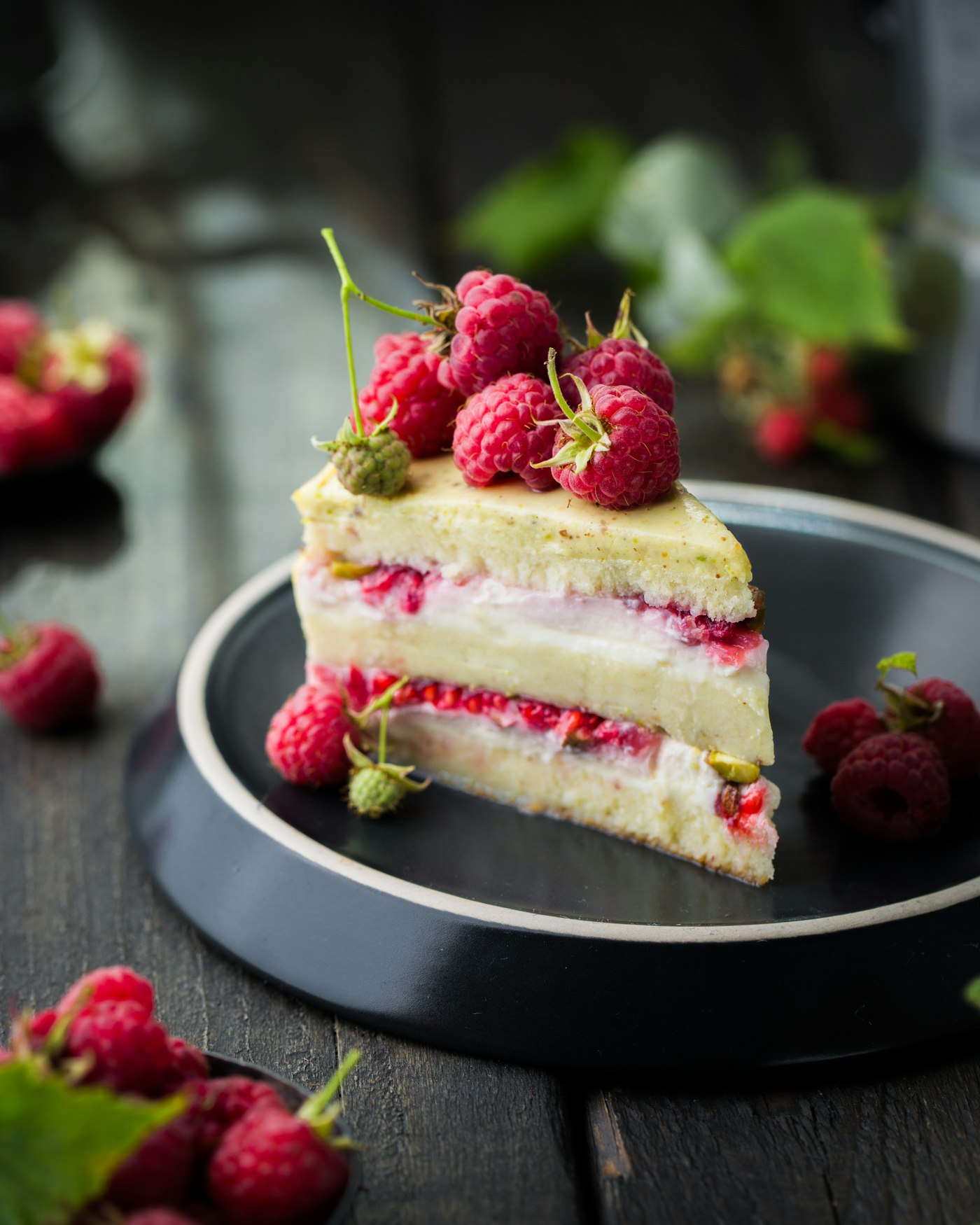 A slice of berry tart on a ceramic plate
